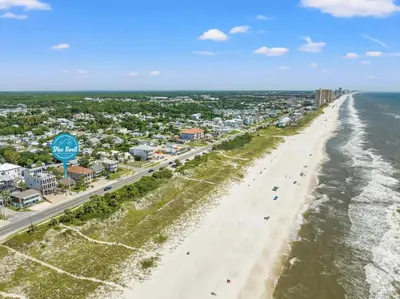 an aerial view of a beach with condos at Cute Beach Cottage Steps to the Beach! Panama City Beach, FL! in Panama City Beach