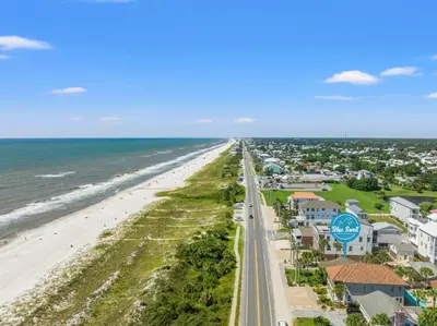an aerial view of a beach with condos at Cute Beach Cottage Steps to the Beach! Panama City Beach, FL! in Panama City Beach