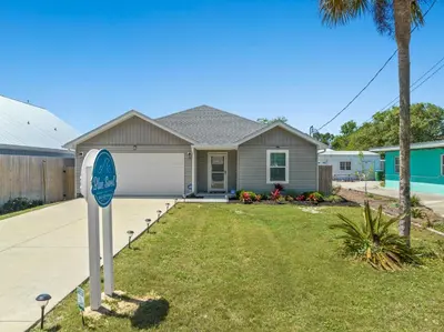 a house with a mailbox in front of a yard at 3BD, 2BA Home! Family Friendly! Close to Beach! HOT TUB! in Panama City Beach