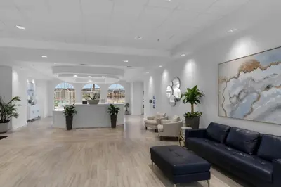 a lobby with a couch and chairs in a building at Calypso 3 Luxury Beach Vacation Sleeps 6 in Panama City Beach