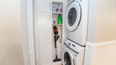 a white washer and dryer in a white room at 5-STAR Beachfront - 2br & 2ba Total Remodel - Dunes of Panama D1105 in Panama City Beach