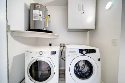 a laundry room with a washer and dryer at Lagoon 2621 by Nautical Properties in Panama City Beach