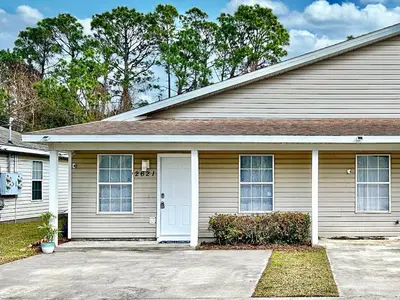 a white house with a white door at Lagoon 2621 by Nautical Properties in Panama City Beach