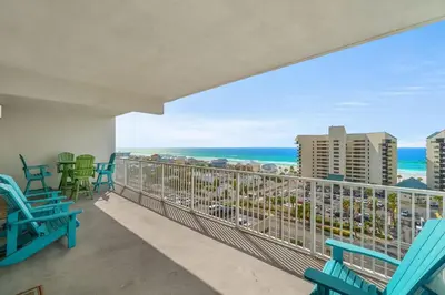 a balcony with chairs and a view of the ocean at Beachy King at Laketown Wharf #812 by Nautical Properties in Panama City Beach