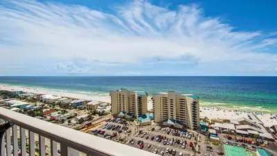 a view of the beach from a balcony of a resort at Sunsational at Laketown Wharf #1924 by Nautical Properties in Panama City Beach