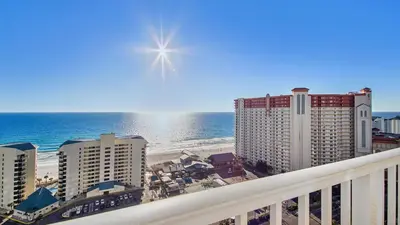 a view of the beach from the balcony of a resort at Laketown Wharf #1819 by Nautical Properties in Panama City Beach