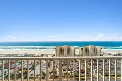 a view of the beach from the balcony of a resort at Sea-Renity at Laketown Wharf #1607 by Nautical Properties in Panama City Beach