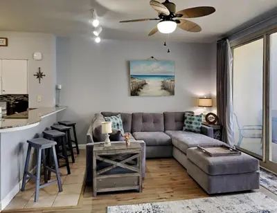 a living room with a couch and a table at Shores of Panama #1823 in Panama City Beach