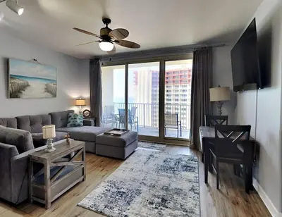 a living room with a couch and a table at Shores of Panama #1823 in Panama City Beach