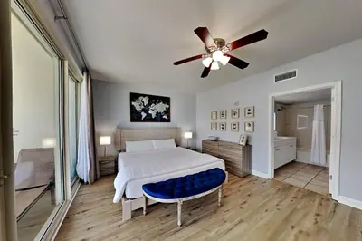 a bedroom with a bed and a ceiling fan at Shores of Panama #1823 in Panama City Beach