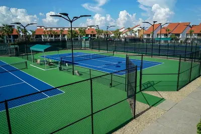 a group of tennis courts on a tennis court at Edgewater Tower Iii 612 in Panama City Beach