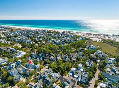 an aerial view of a beach with houses and the ocean at Flagship of Watersound in Watersound Beach