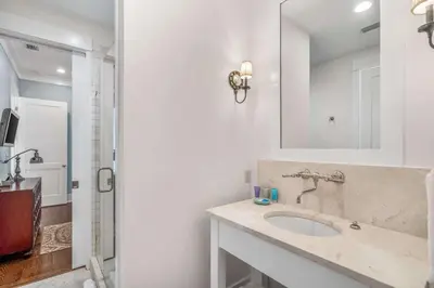 a bathroom with a sink and a mirror at Flagship of Watersound in Watersound Beach
