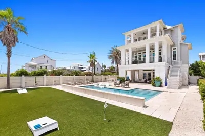 a large white house with a pool and a yard at SEAcret to Life in Inlet Beach