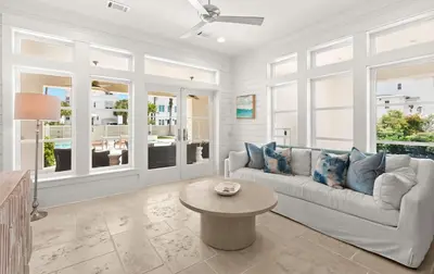 a living room with a couch and a table at SEAcret to Life in Inlet Beach