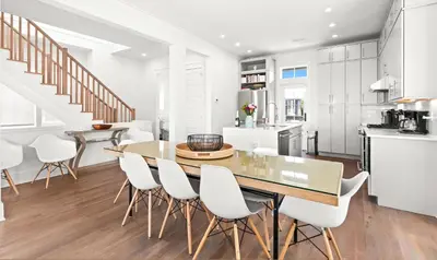 a kitchen and dining room with a table and chairs at Moonstruck in Santa Rosa Beach