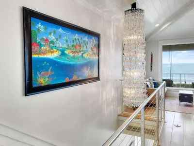 a large painting on the wall in a living room at The Sundowner in Panama City Beach