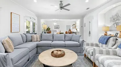 a living room with a couch and a table at Flamingo Key in Santa Rosa Beach
