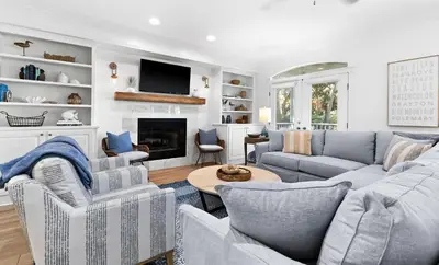 a living room with couches and a fireplace at Flamingo Key in Santa Rosa Beach