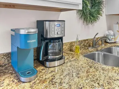 a coffee maker sitting on a counter next to a sink at Grove Getaway in Santa Rosa Beach