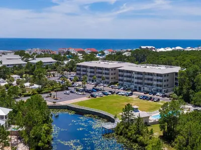an aerial view of a resort with a body of water at Grove Getaway in Santa Rosa Beach