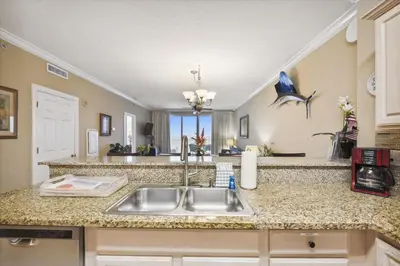 a kitchen with a sink and a counter top at Twin Palms Resort #1502 by Book That Condo in Panama City Beach