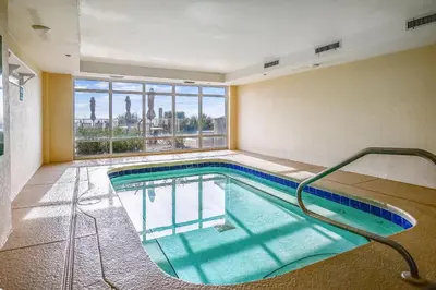 a large indoor swimming pool with a view of the city at Twin Palms Resort #1502 by Book That Condo in Panama City Beach