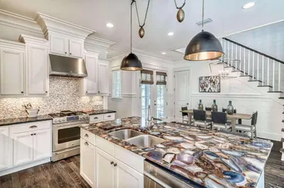 a kitchen with a sink and a counter top at Seabourn in Santa Rosa Beach