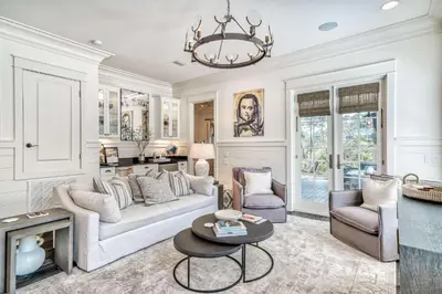 a living room with a couch and chairs and a chandelier at Seabourn in Santa Rosa Beach