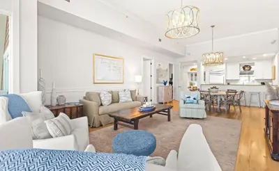 a living room with a couch and a table at Jewel Box at Watersound in Inlet Beach