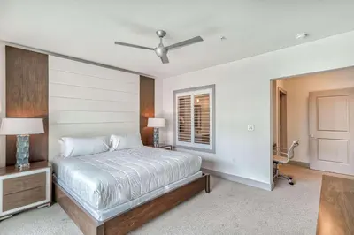 a bedroom with a bed and a ceiling fan at Cabanas and Sunsets in Inlet Beach