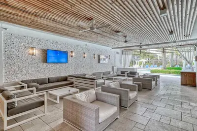 a living room with couches and a flat screen tv at Cabanas and Sunsets in Inlet Beach
