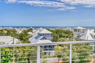a view of the ocean from the balcony of a house at Cabanas and Sunsets in Inlet Beach