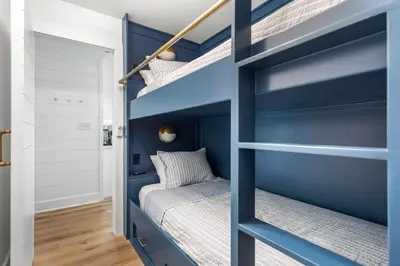 a bunk bed room with a blue bunk bed in a bedroom at After Dune Delight in Santa Rosa Beach