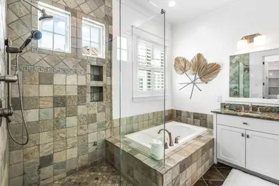 a bathroom with a shower and a tub and a sink at Sunshine and Fresh Air in Inlet Beach