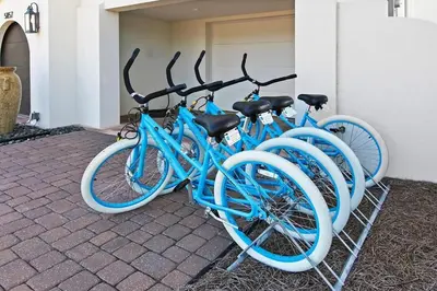 a group of blue bikes parked next to a building at Seas the Day in Santa Rosa Beach