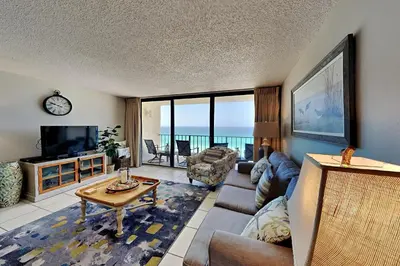 a living room with a view of the ocean at Edgewater Tower Iii 1109 in Panama City Beach