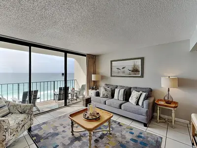 a living room with a couch and a table at Edgewater Tower Iii 1109 in Panama City Beach