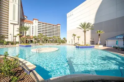 a large swimming pool in front of a building at Blissful Sunset at Laketown Wharf #1312 by Nautical Properties in Panama City Beach