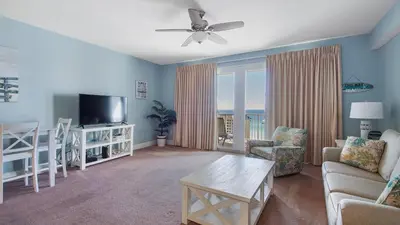 a living room with a couch and a tv at Laketown Wharf #1319 by Nautical Properties in Panama City Beach