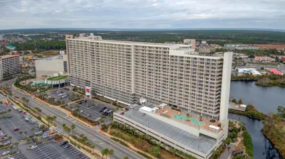 an aerial view of a large building next to a river at Nautical Breeze at Laketown Wharf #1911 by Nautical Properties in Panama City Beach