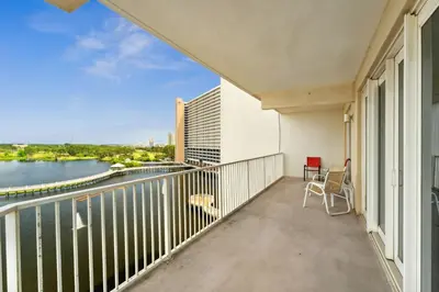 a balcony of a building with a view of a river at Laketown Wharf #638 by Nautical Properties in Panama City Beach
