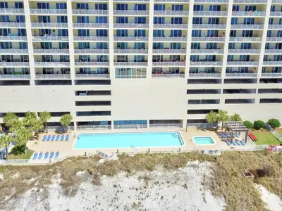 an aerial view of a large apartment building with a pool at Ocean Reef #2109 by Nautical Properties in Panama City Beach