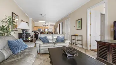 a living room with a couch and a table at Ocean Reef #2109 by Nautical Properties in Panama City Beach