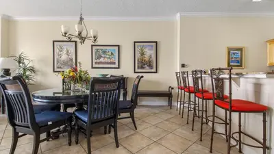 a dining room with a table and chairs at Ocean Reef #2109 by Nautical Properties in Panama City Beach