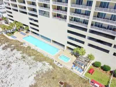 an overhead view of a large apartment building with a swimming pool at Ocean Reef #2109 by Nautical Properties in Panama City Beach