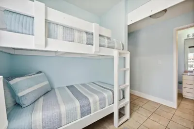 a bunk bed room with two bunk beds at Laketown Wharf #828 by Nautical Properties in Panama City Beach