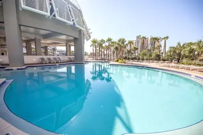 a large swimming pool in front of a building at Laketown Wharf #828 by Nautical Properties in Panama City Beach