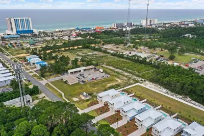 an aerial view of a city and the ocean at Beach House - Sugary Sands by Panhandle Getaways in Panama City Beach