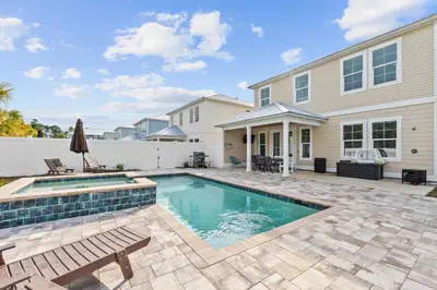 a swimming pool in the backyard of a house at Pet Friendly Beach House - Sugary Sands by Panhandle Getaways in Panama City Beach